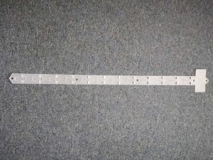 Plastic Display Strip: Overall length 615mm. Width 38mm. 12 hooks spaced 45mm apart.